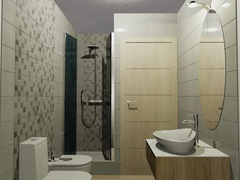 Revestimiento de paredes y lavabo en mármol gris para baño residencial en Alicante.